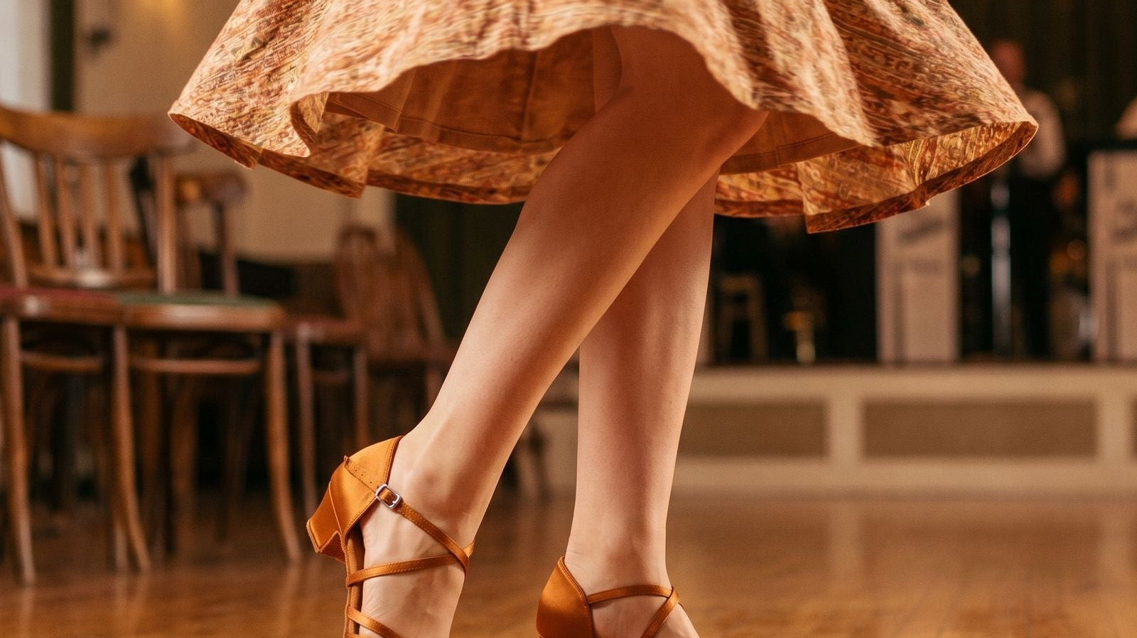 Suntan salsa dance shoes with low Cuban heel worn by a dancer - TTdancewear