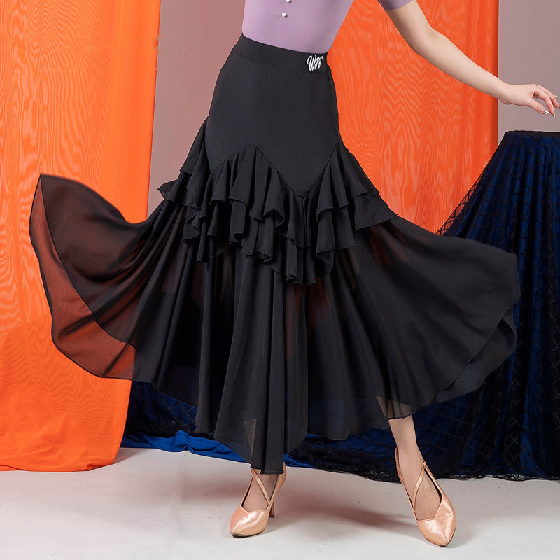 Black ballroom dance skirt with double ruffle flounce and sheer chiffon overlay, hip and hem view