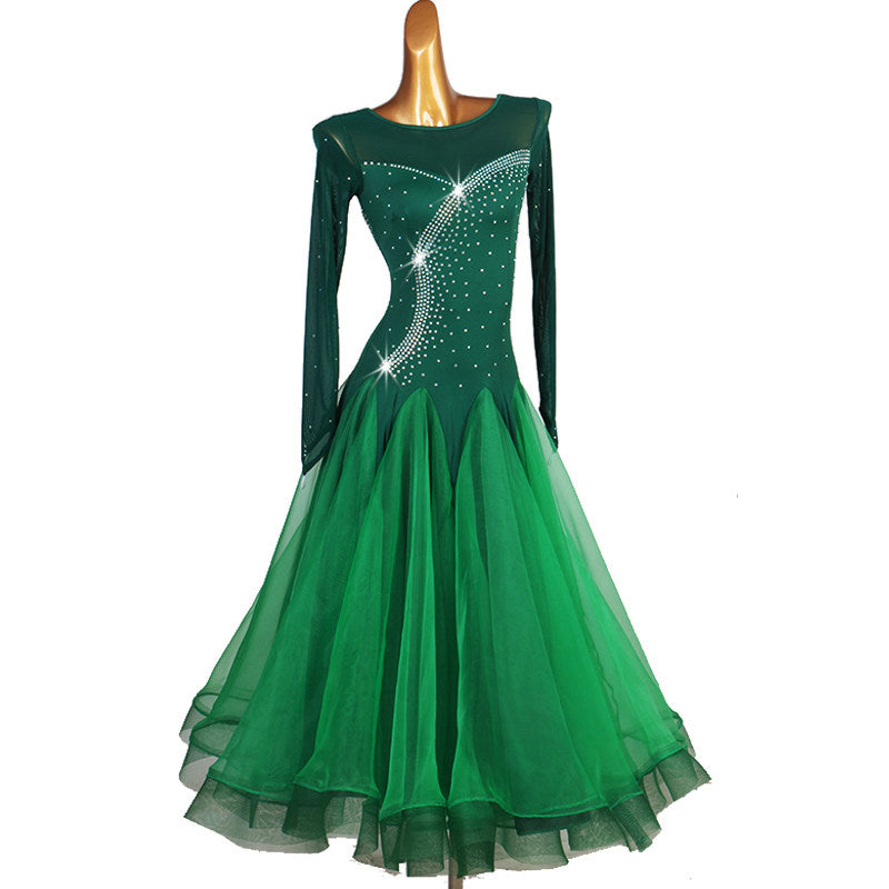 Dark green rhinestone ballroom competition dress with illusion mesh long sleeves on mannequin