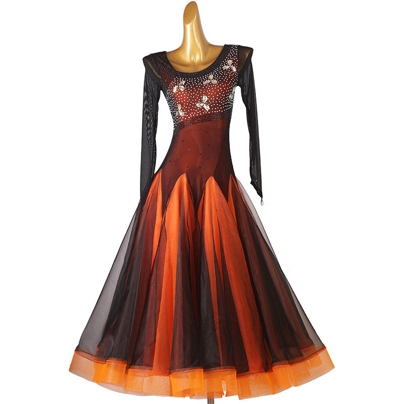 Orange ballroom competition dress with beaded floral mesh yoke and black overlay skirt