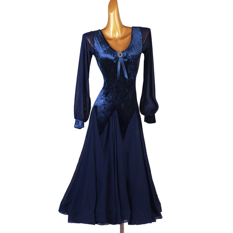 Navy velvet ballroom dance dress with satin bow detail and full puff sleeves