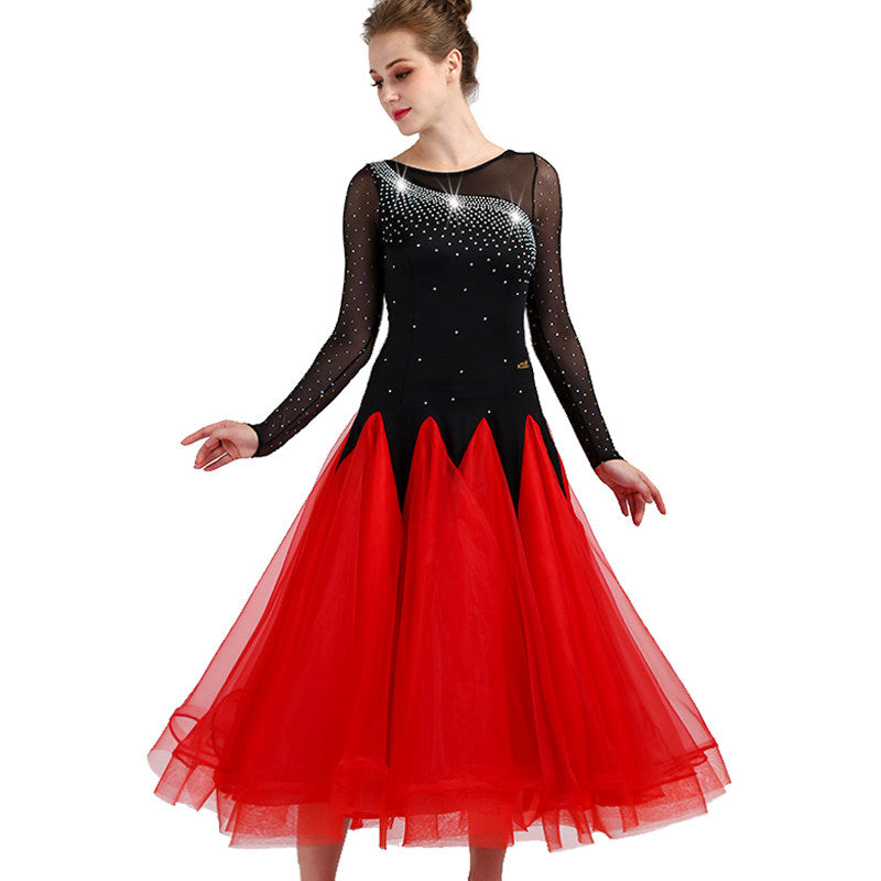 Black and red ballroom gown with rhinestone mesh yoke worn by a dancer