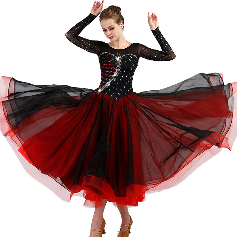Black and red ballroom competition dress shown mid turn on a dancer