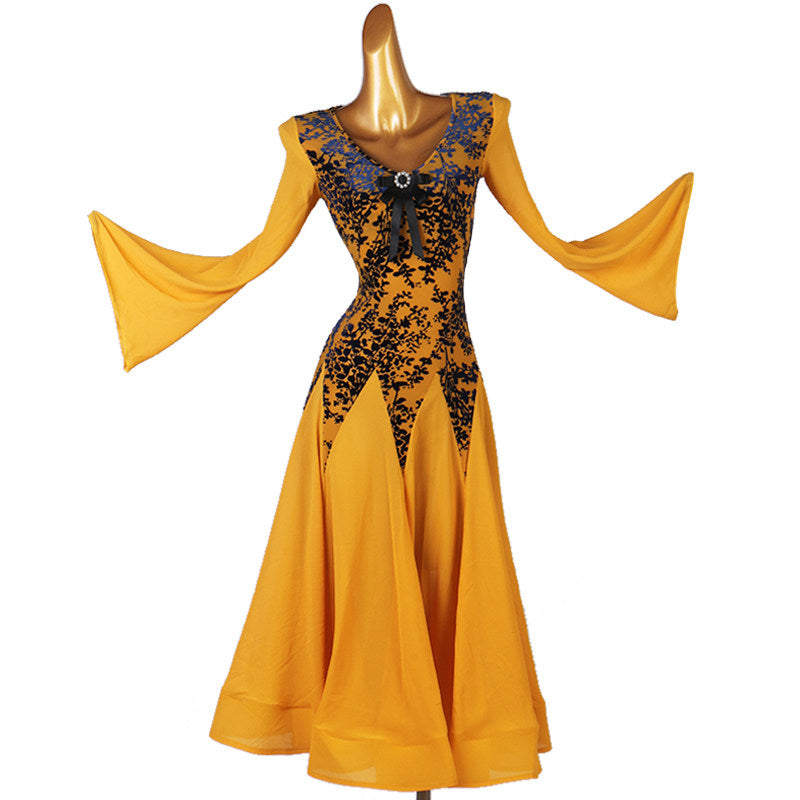 Golden ballroom dance dress with both bell sleeves opened wide to the side