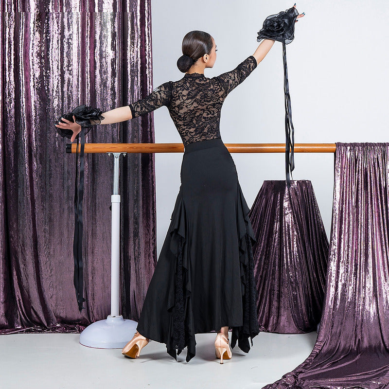 Back view of the black ruched waist ballroom dance skirt with lace insert side ruffles