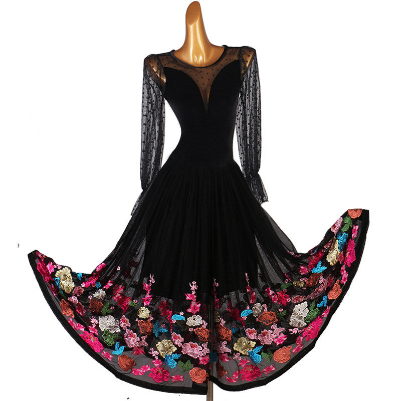 Black ballroom dance dress with the embroidered hem sweeping wide on a turn