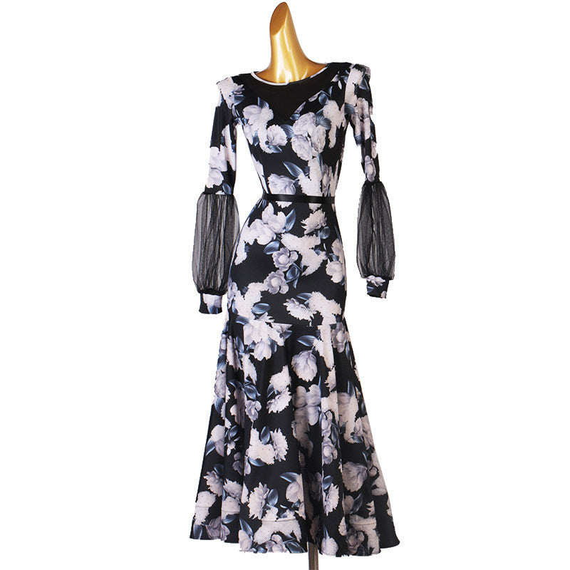 Black floral ballroom dance dress showing the mesh forearm sleeves