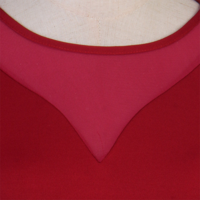 Close up of the sheer mesh V yoke on the red ballroom practice dress