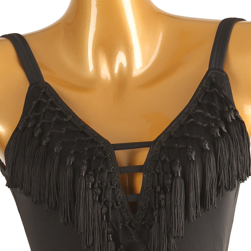 Close-up of the knotted tassel fringe and strappy caged V neckline