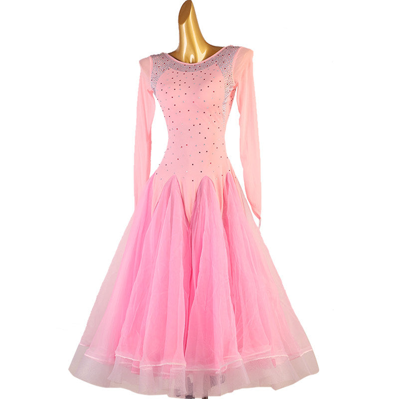 Pink ballroom competition dress front view with the tulle skirt spread