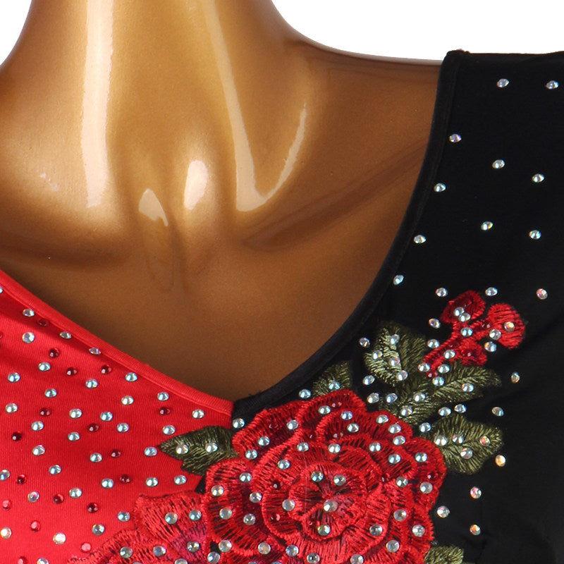Close up of the red rose embroidery and rhinestone spray on the black bodice