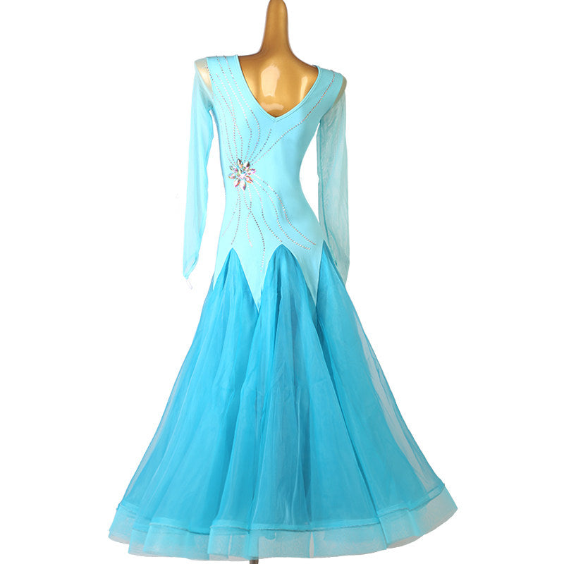 Turquoise ballroom competition dress with the streamer sleeves hanging