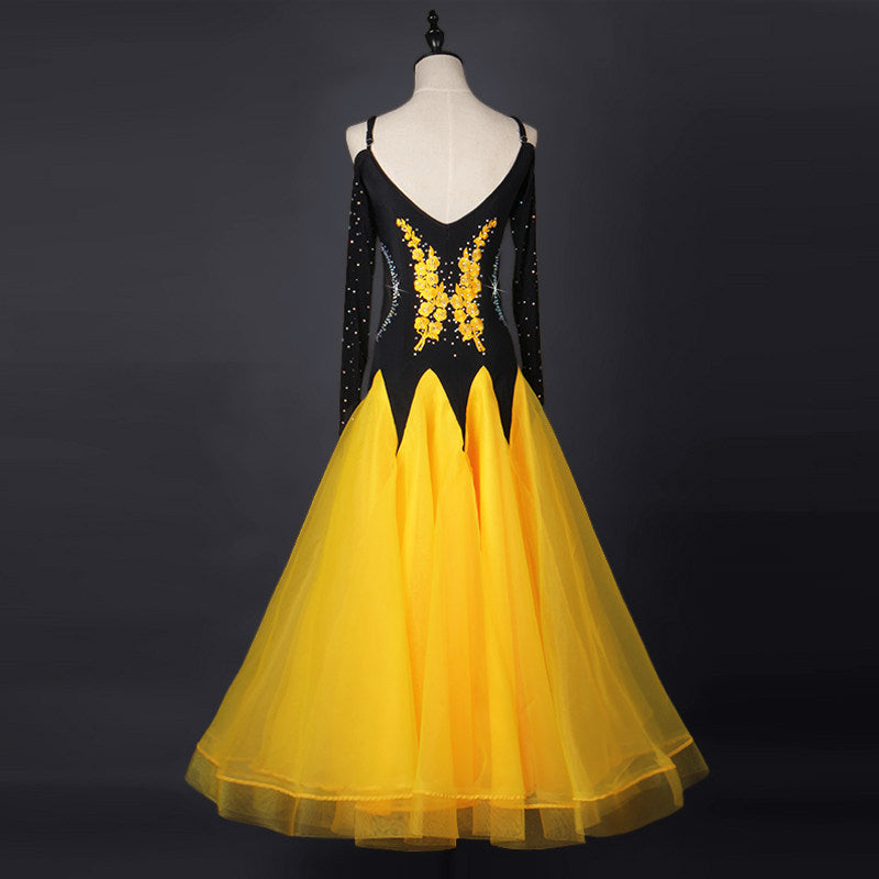 Yellow ballroom competition dress front view on mannequin, organza skirt spread
