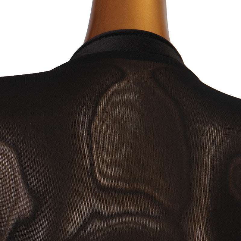 Close up of the sheer mesh back on the black velvet ballroom dress