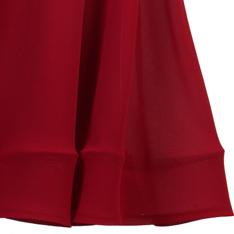 Close up of the banded chiffon hem on the wine red skirt