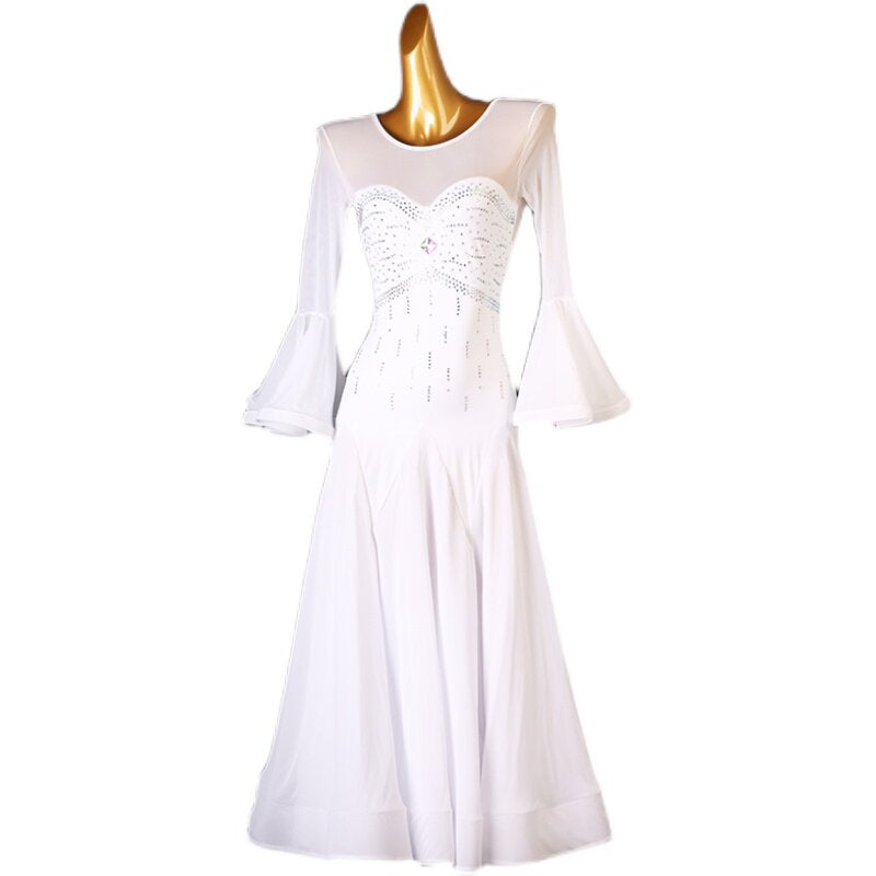 White beaded ballroom competition dress photographed on a light background