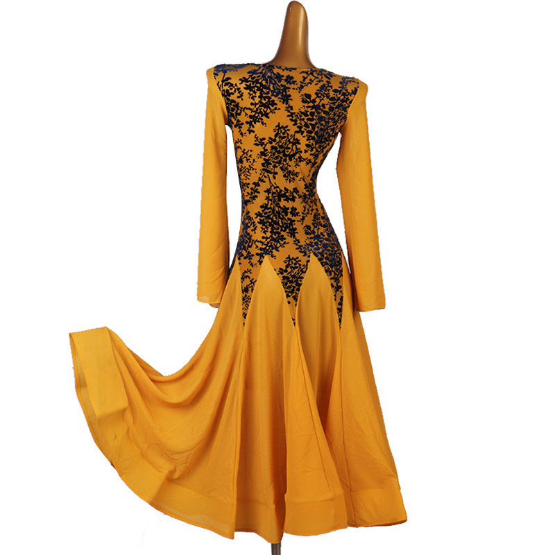 Golden ballroom dance dress side view with the chiffon skirt lifted