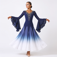 Dancer in a navy to white ombre ballroom competition dress with rhinestone V neck and tiered chiffon sleeves