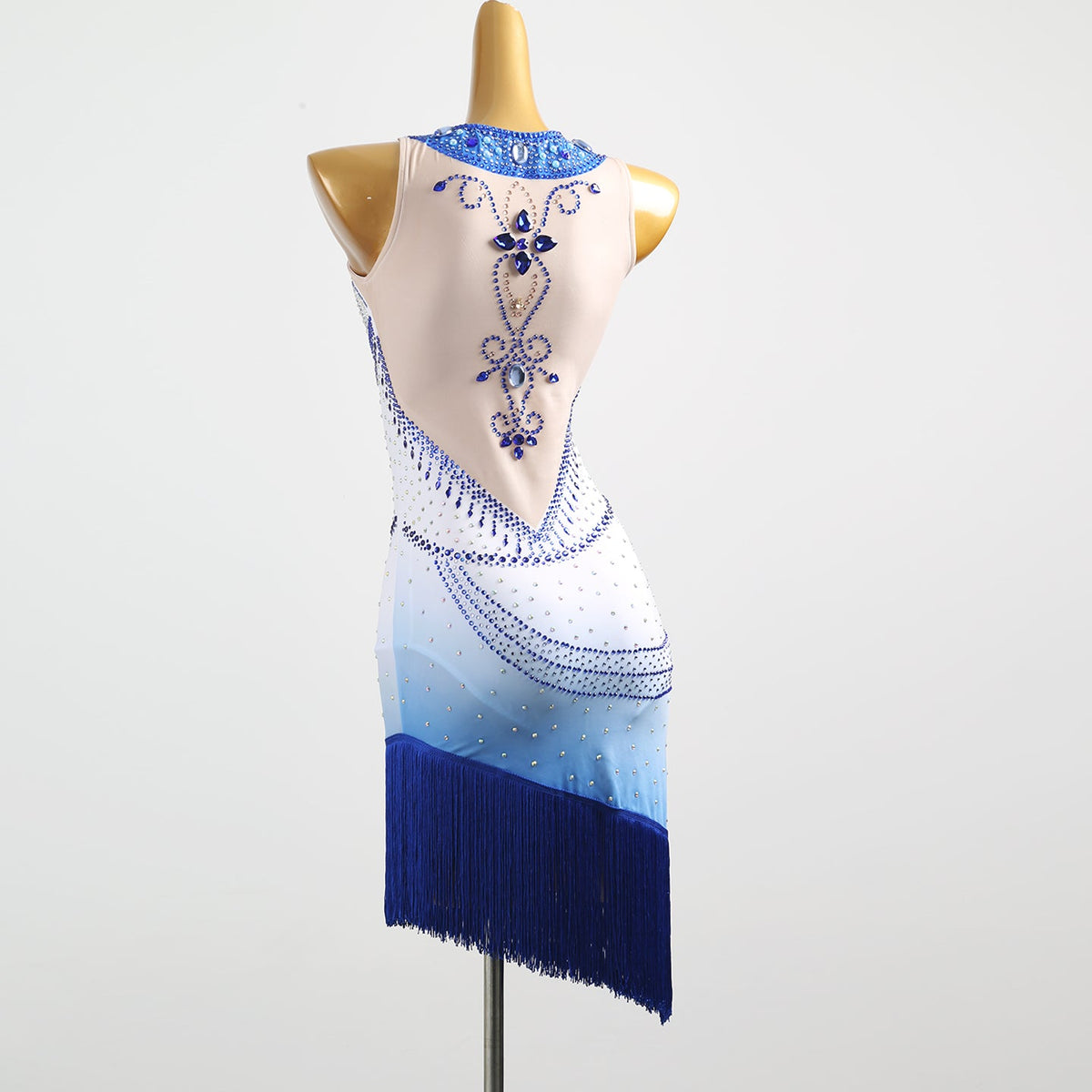 White and blue ombre beaded motif dress, angled back view on mannequin
