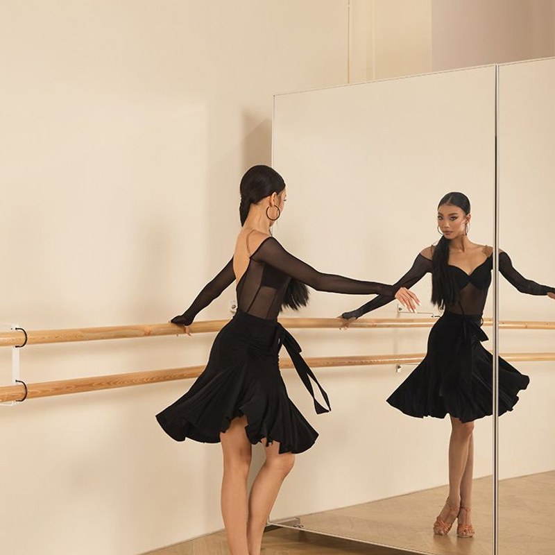 Black ruffle skirt, back view in motion