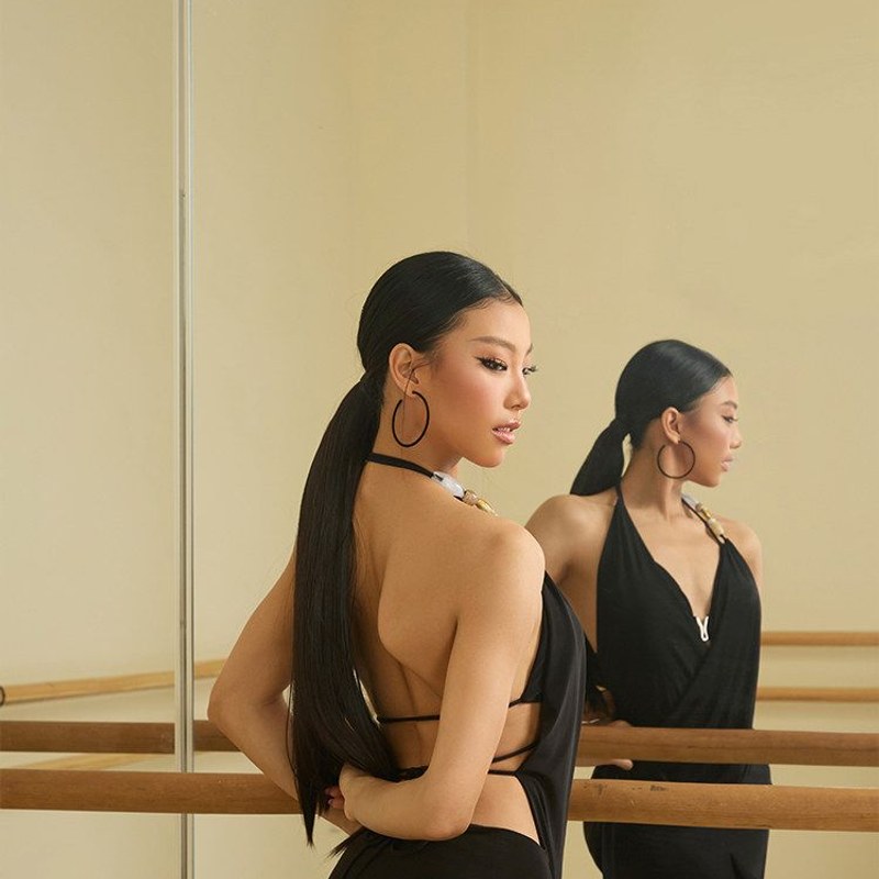 Black cowl neck halter top, back view in the mirror