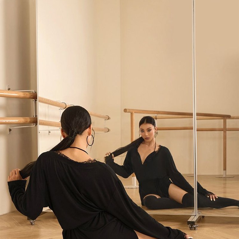 Black oversized long sleeve tunic top, seated view