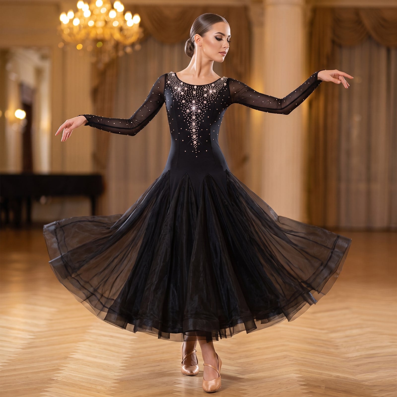 Black ballroom dance dress with pearls and rhinestones scattered over the long sleeved bodice