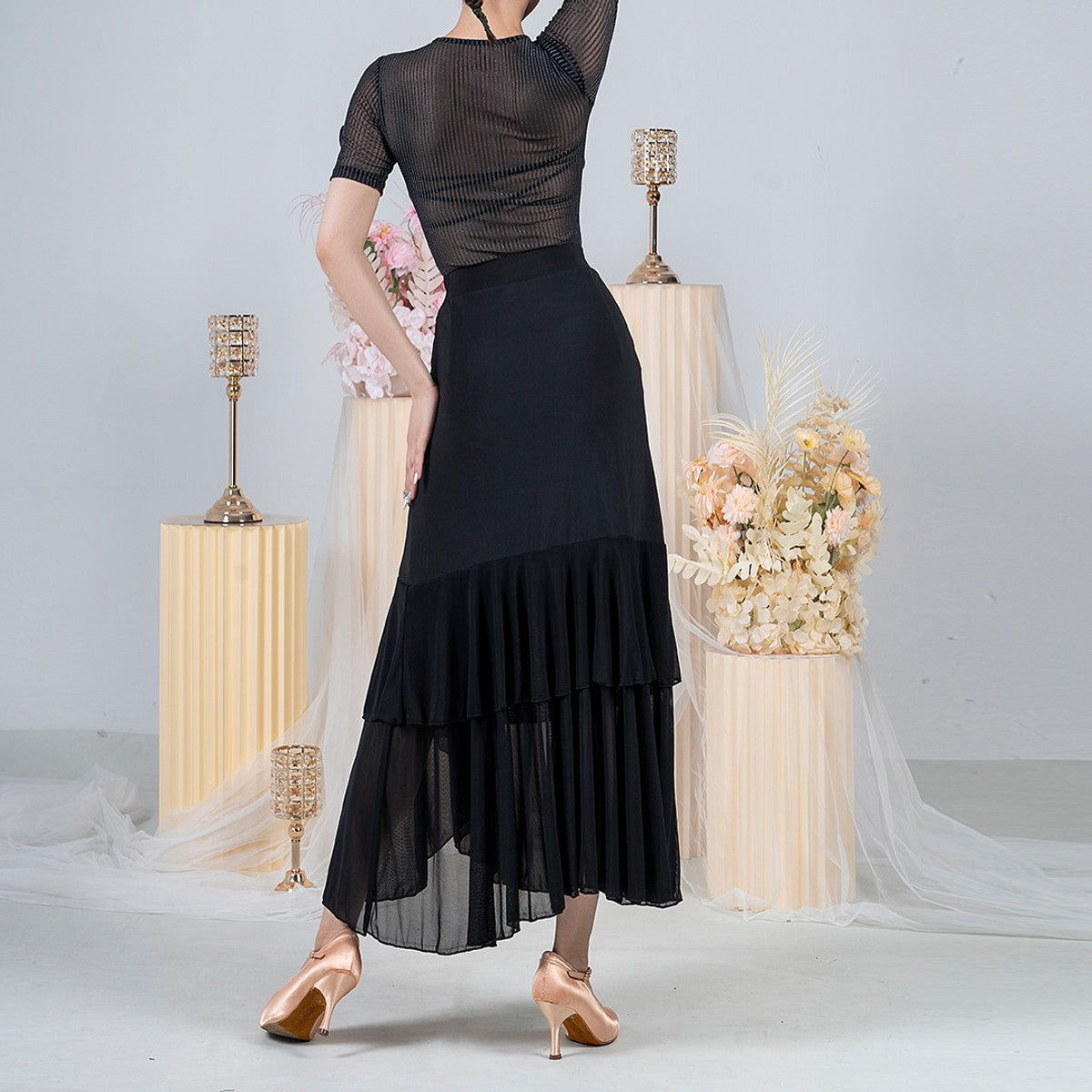 Black ballroom practice skirt with tiered sheer mesh hem, back view