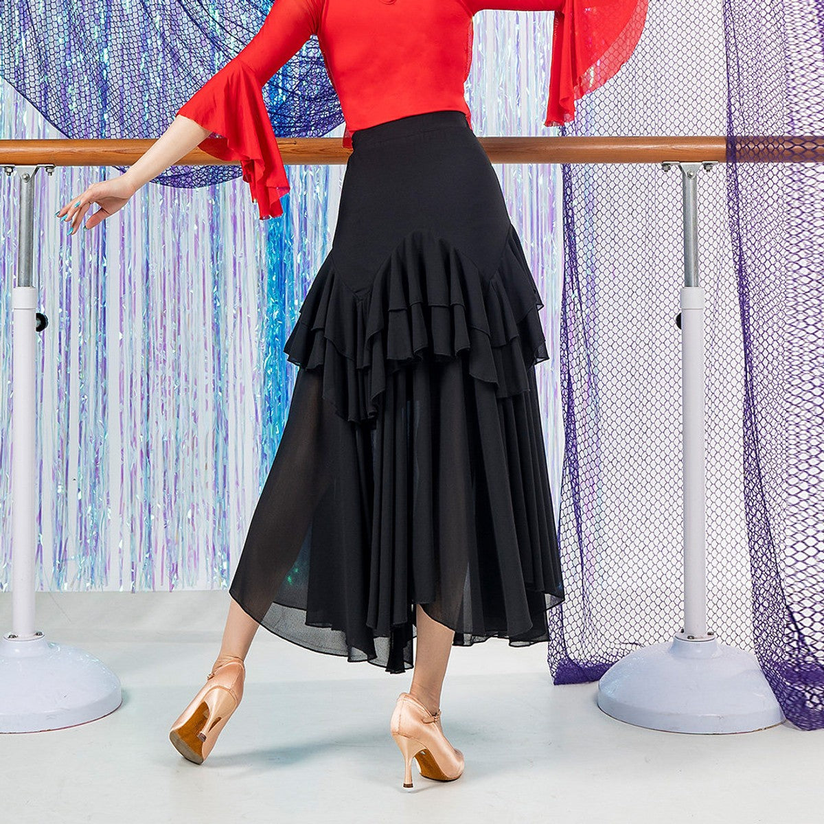 Black ballroom dance skirt with ruffle tiers and chiffon hem, back view