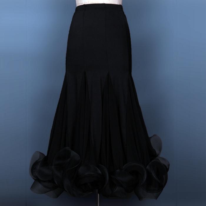 Black ballroom dance skirt with mermaid godet flare and organza ruffle hem, front view