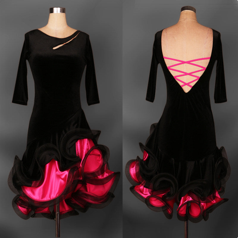 Black velvet latin dance dress with pink ribbon lacing across the open back