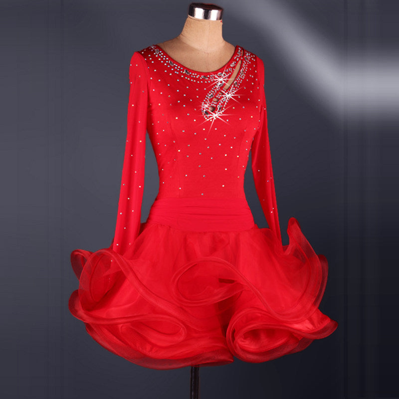 Red rhinestone latin dance dress showing the scattered stones across the bodice and shoulders