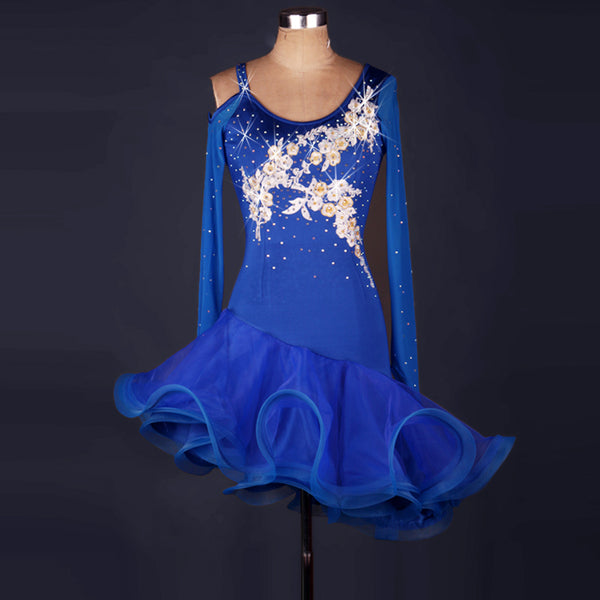 Blue latin dance dress with white floral appliques across the bodice and cold shoulder mesh sleeves