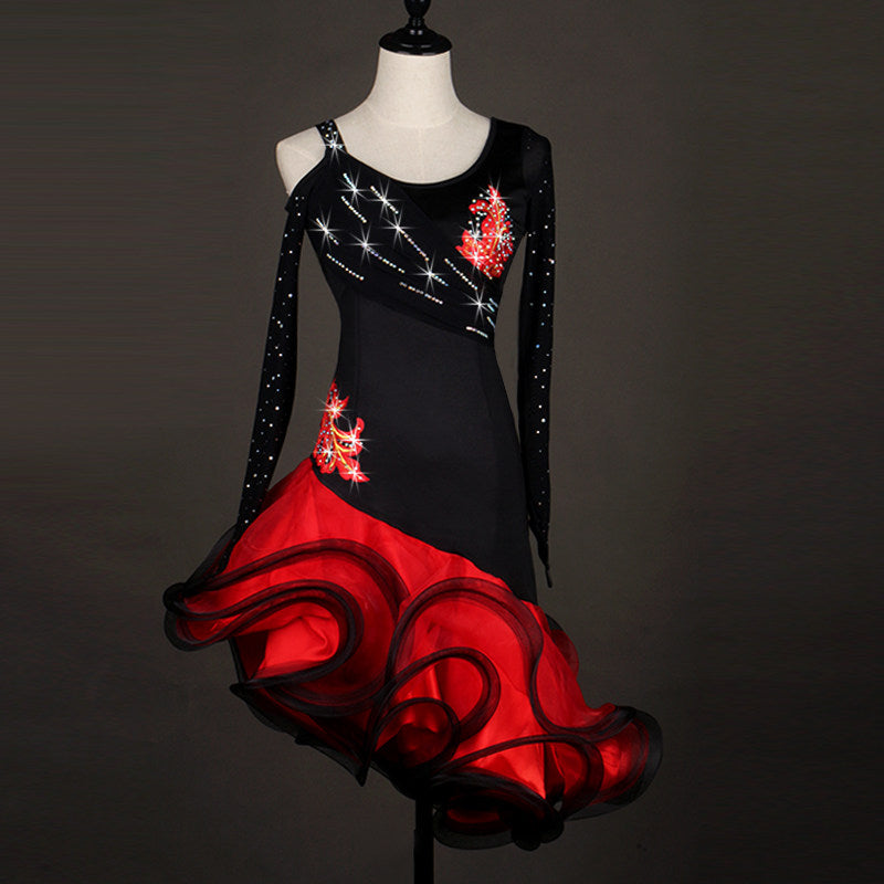 Black and red latin dance dress with diagonal rhinestone lines and a red floral applique