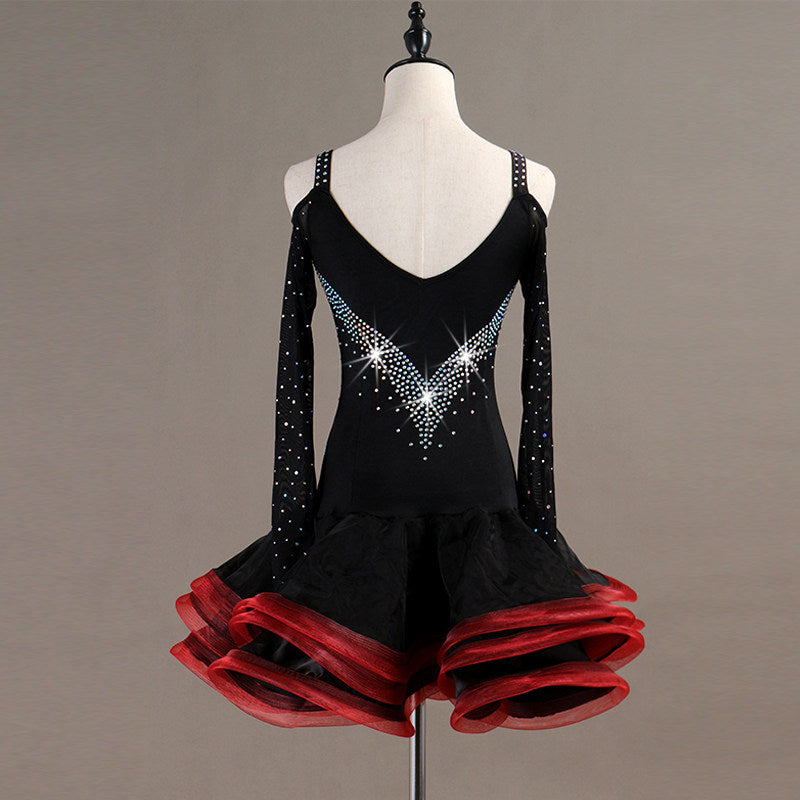 Black latin dance dress rear view showing the open back and red ruffle hem