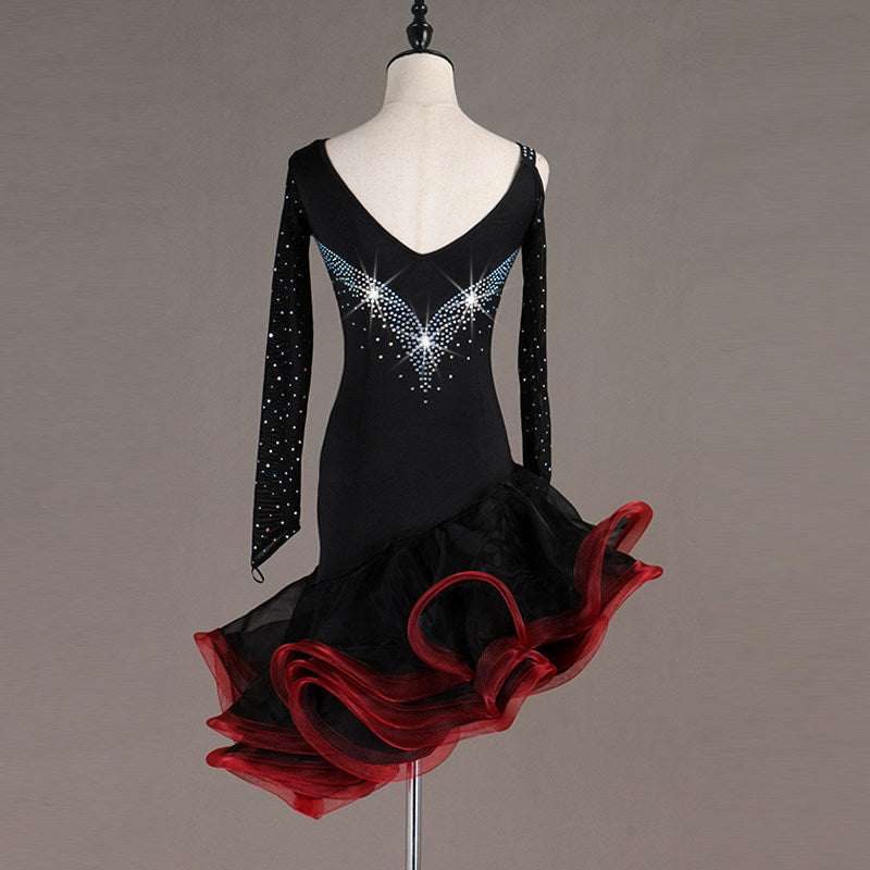 Black latin dance dress side view with the red and black ruffle layers