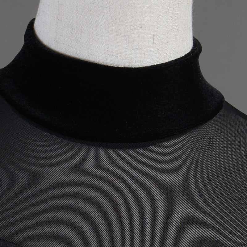 Close view of the sheer mesh high neck collar on velvet