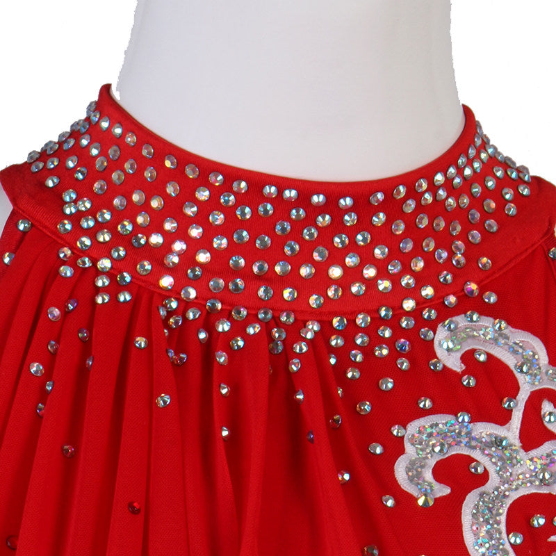 Close view of the silver applique packed with rhinestones on red