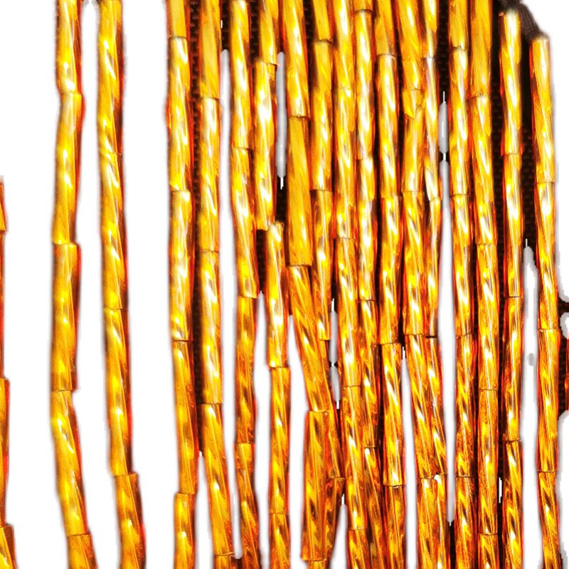 Close view of the gold bugle fringe hanging from the sheer mesh yoke