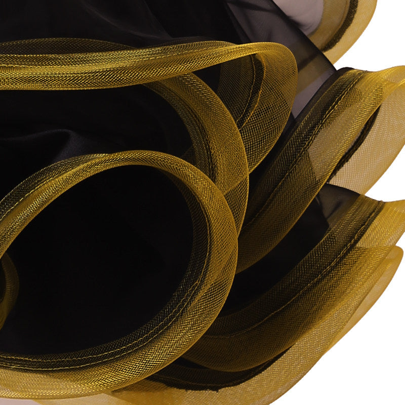 Close view of the gold edged curled organza ruffle layers
