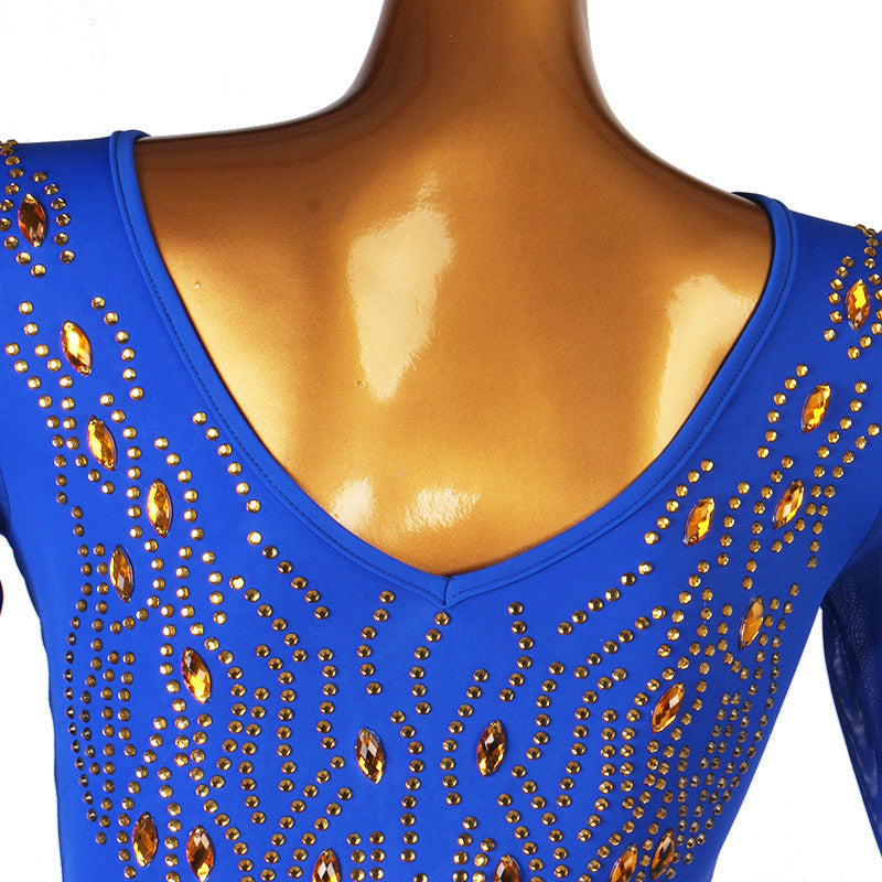 Close view of the amber and clear stones set across the blue shoulder