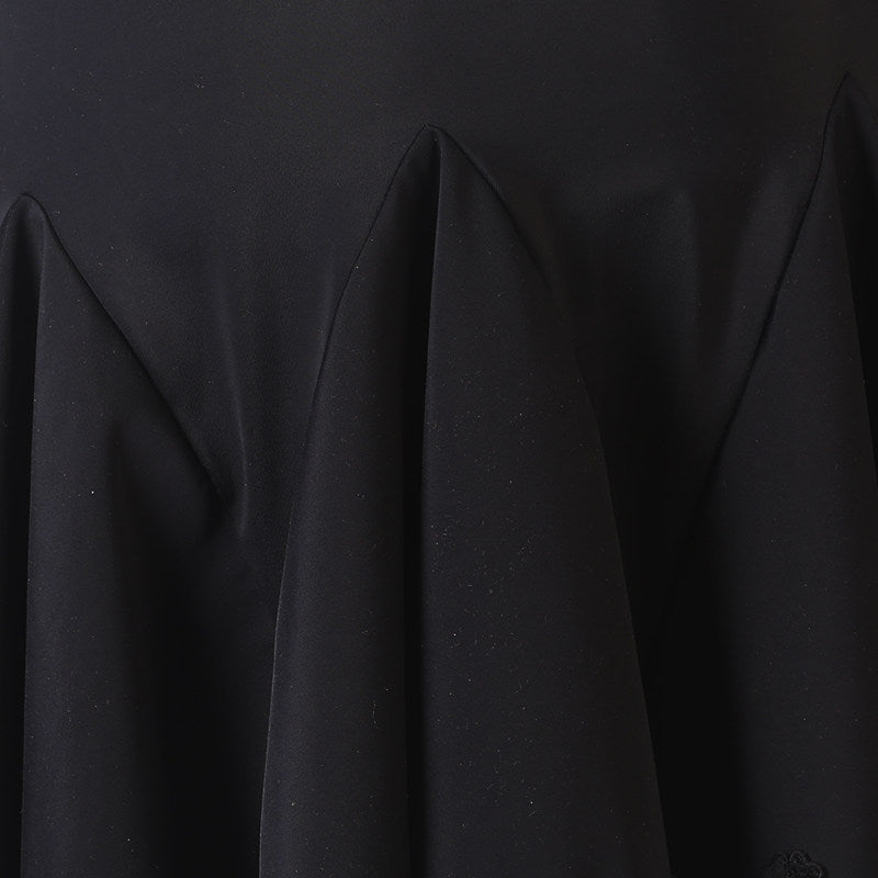 Close view of the fluted hem on the black practice skirt