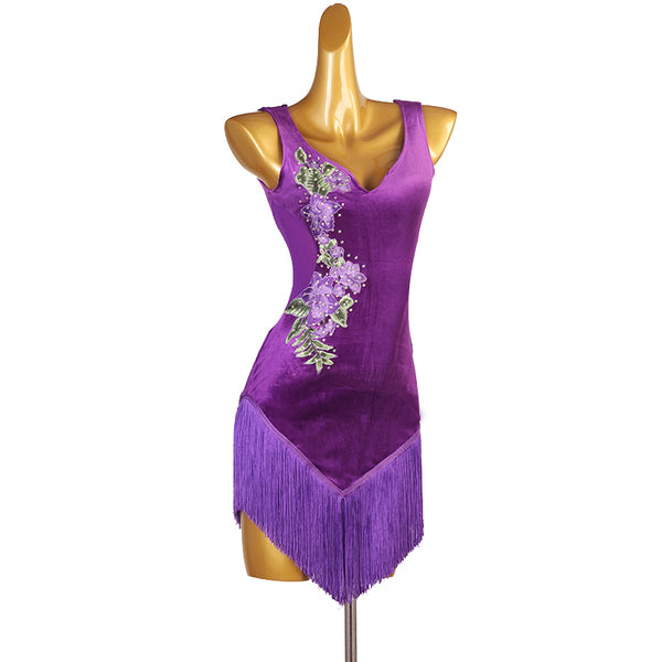 Close view of the raised embroidered flowers on purple velvet