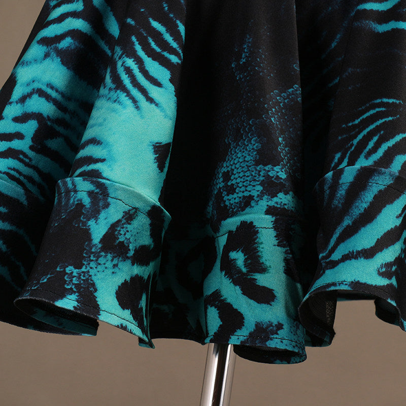 Close view of the turquoise animal print on the skirt