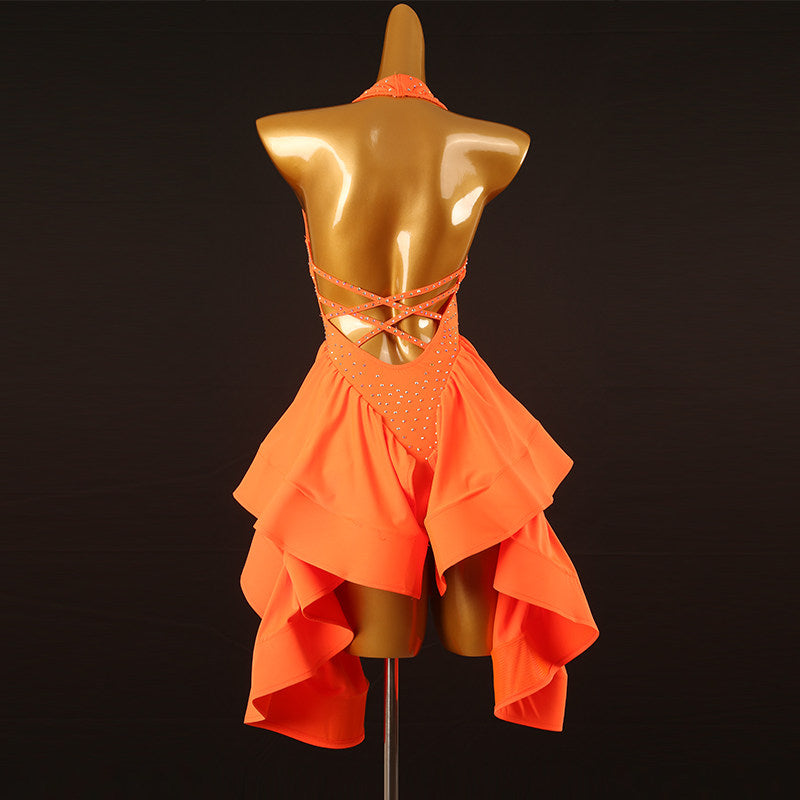 Orange stone latin salsa dance dress angled view showing the ruffle cascade