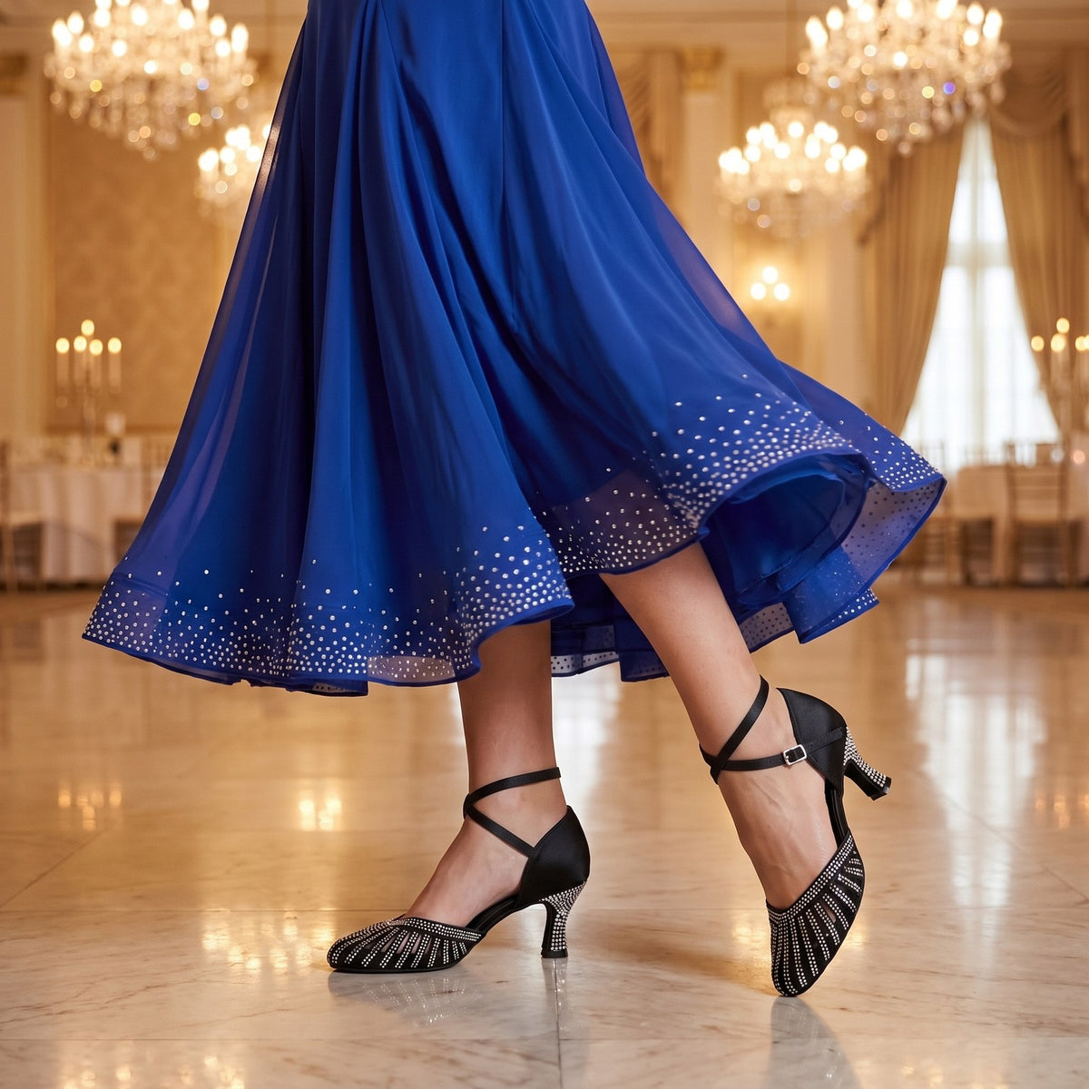 on-foot shot of black satin closed toe ballroom waltz dance shoes for women with a rhinestone striped vamp, crisscross ankle straps and rhinestone heel