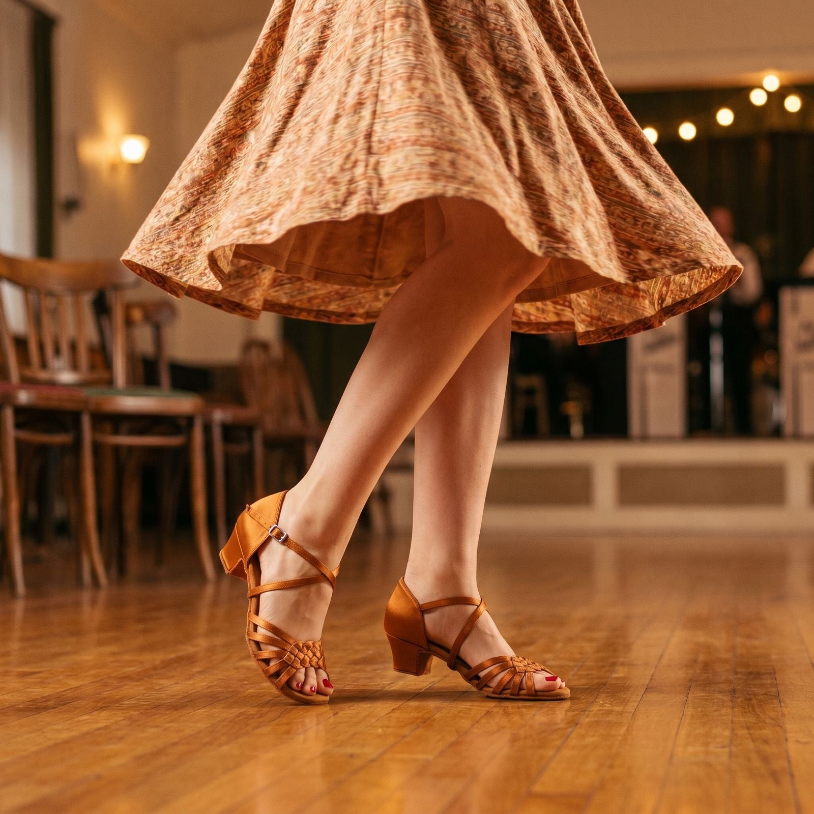 Suntan salsa dance shoes with low Cuban heel worn by a dancer - TTdancewear