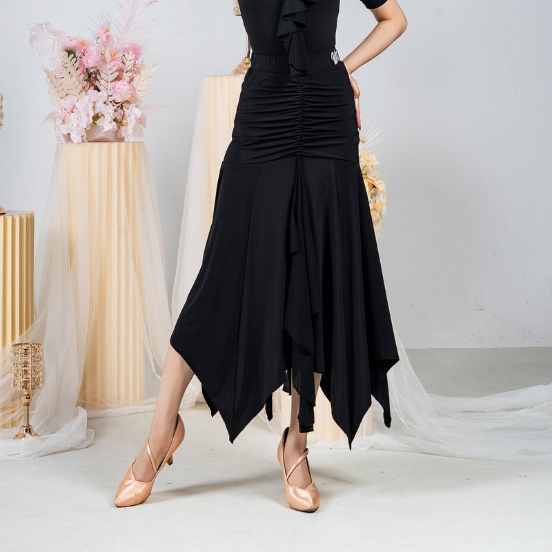 Black ballroom dance skirt with ruched hip yoke and pointed hem, hip and hem view
