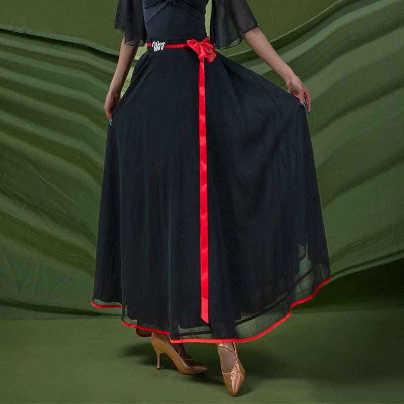 Black tiered chiffon ballroom dance skirt with red satin ribbon trim and bow sash