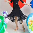 Black ballroom dance skirt with dotted mesh hem band, hip and hem view